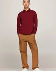 Polo manches longues Tommy Hilfiger rouge en coton bio stretch | Georgespaul