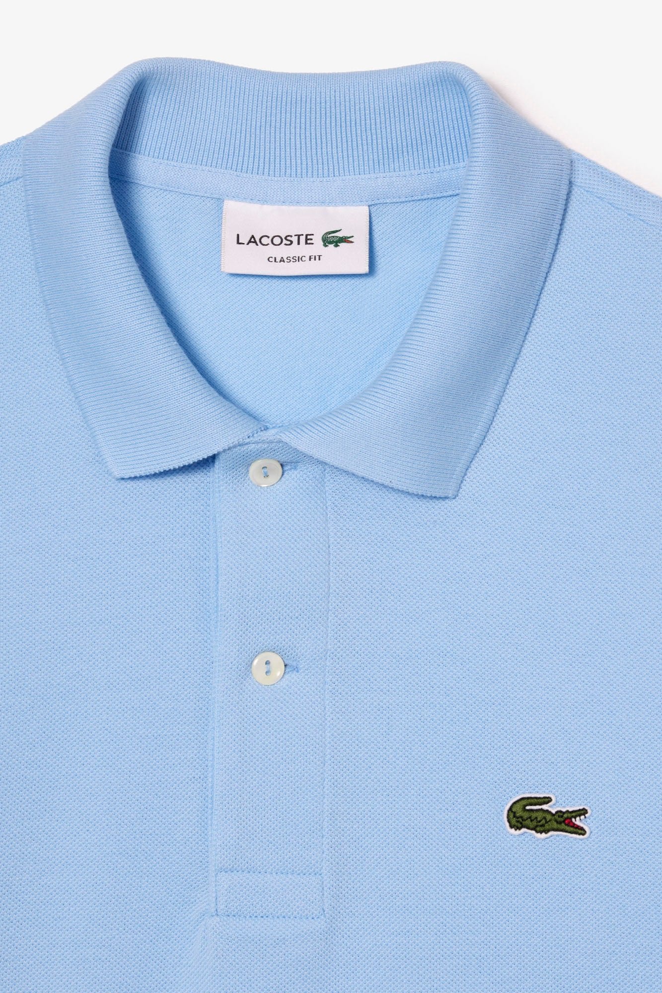 Polo manches longues Lacoste bleu - Georgespaul