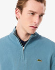 Pull camionneur Lacoste bleu pour homme | Georgespaul 