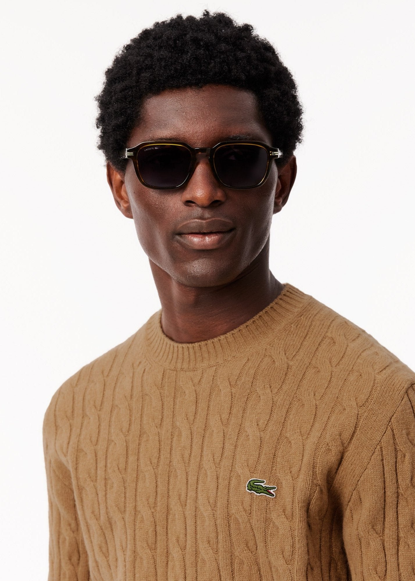 Pull torsadé Lacoste beige en laine pour homme | Georgespaul