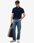 polo-tommy-hilfiger-marine-homme-MW0MW17770DCC-porte